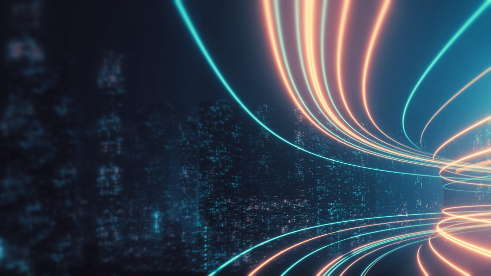 An abstract image of glowing orange and teal light trails moving in a tunnel, with a blurry, data-like background.