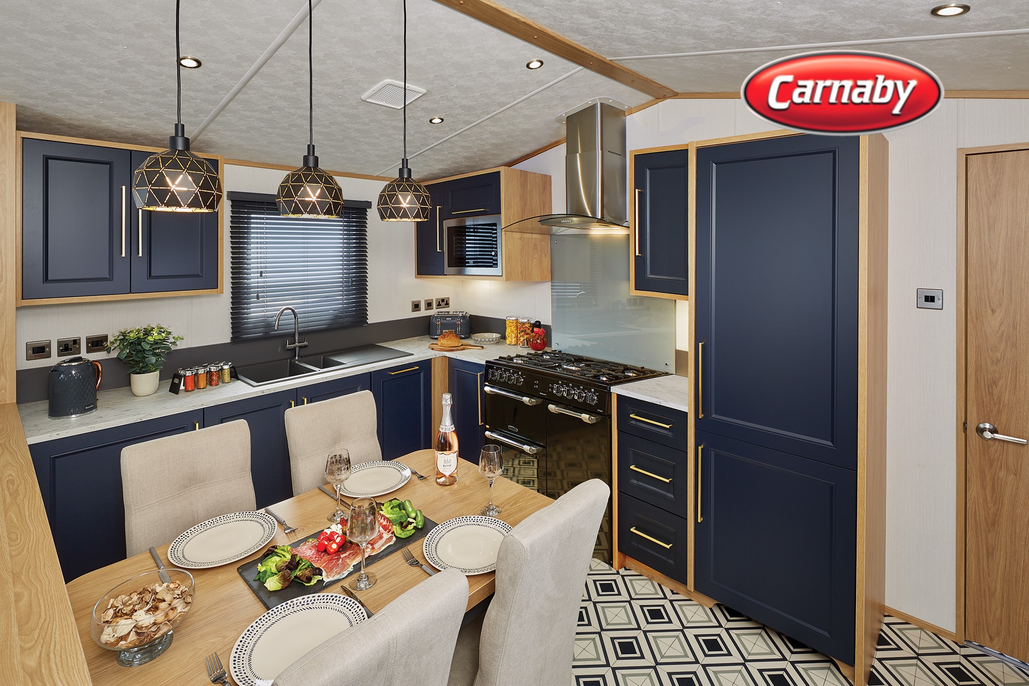 A modern kitchen and dining area with blue cabinets and a black oven.