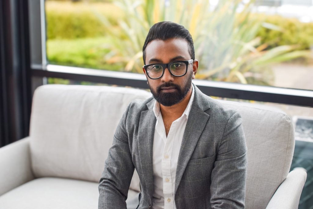 Shenal Wijetunge, a business professional, looking directly at the camera with a serious expression.