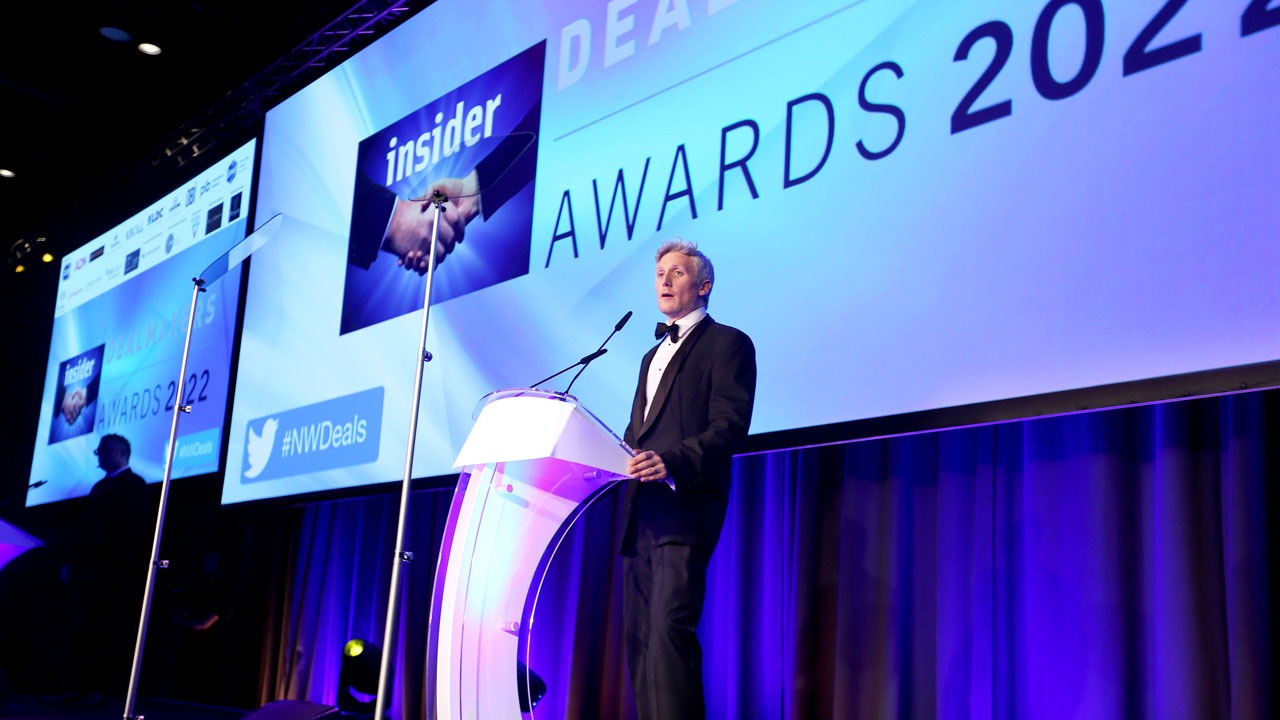 Simon Keegan, Insider editor, standing talking into a mic at the awards ceremony for the Insider Awards